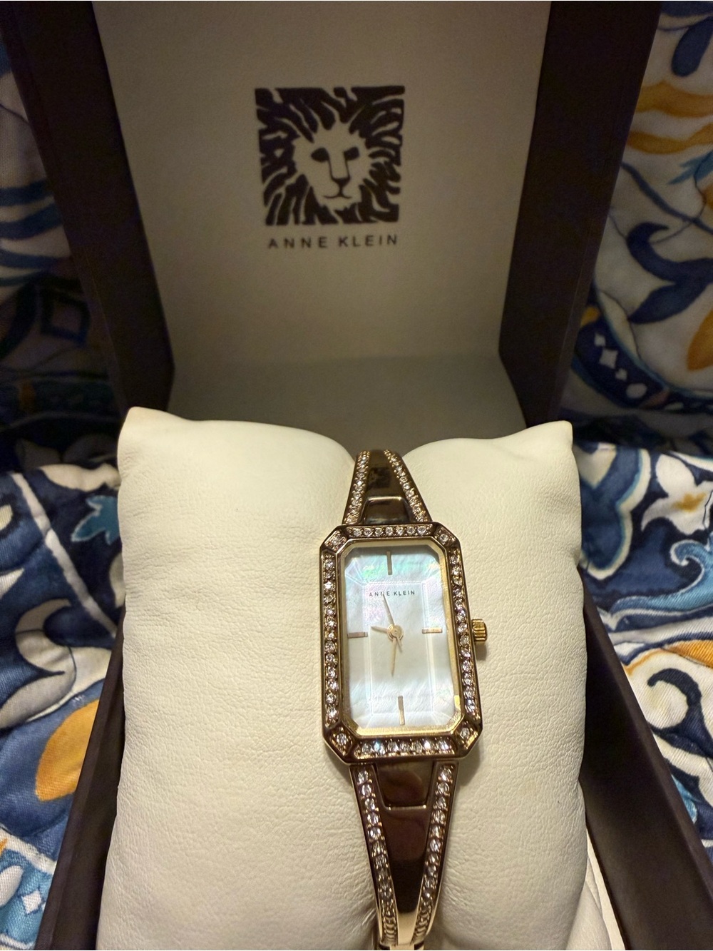 Anne Klein Gold-Tone Crystal Bangle Watch with Mother of Pearl Dial